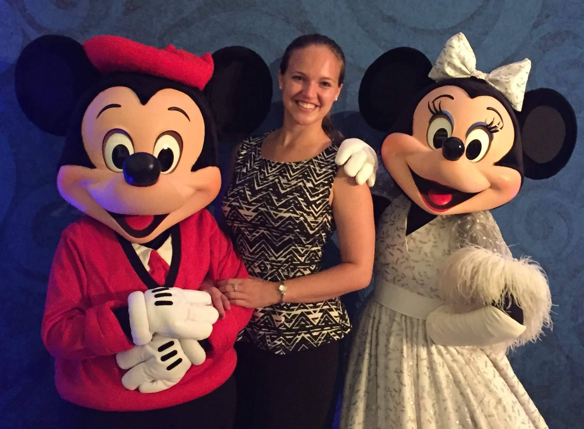 Elizabeth Stolz posing with Mickey and Minnie mouse